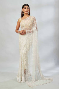 Shop cream embroidered net designer sari online in USA. Look your best on festive occasions in latest designer saris, pure silk saris, Kanjivaram silk sarees, handwoven saris, tussar silk sarees, linen sarees,  embroidered sarees from Pure Elegance Indian clothing store in USA.-full view