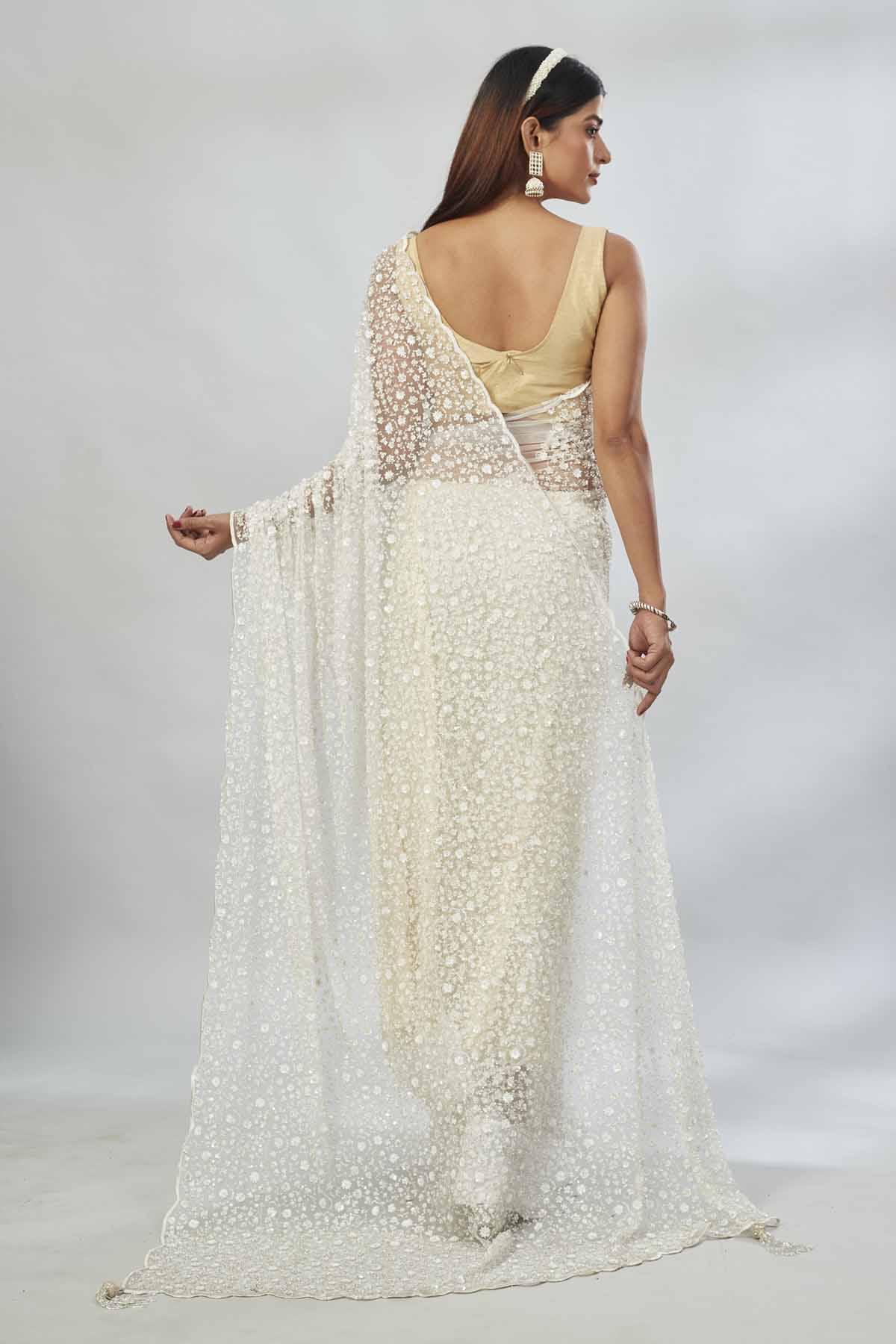 Shop cream embroidered net designer sari online in USA. Look your best on festive occasions in latest designer saris, pure silk saris, Kanjivaram silk sarees, handwoven saris, tussar silk sarees, linen sarees,  embroidered sarees from Pure Elegance Indian clothing store in USA.-back