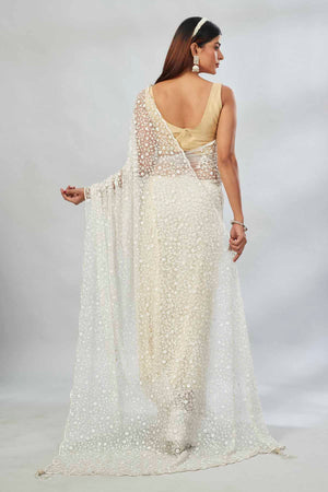 Shop cream embroidered net designer sari online in USA. Look your best on festive occasions in latest designer saris, pure silk saris, Kanjivaram silk sarees, handwoven saris, tussar silk sarees, linen sarees,  embroidered sarees from Pure Elegance Indian clothing store in USA.-back