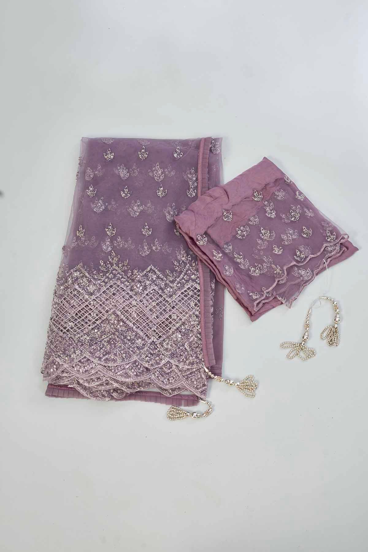 Buy mauve embroidered net designer sari online in USA. Look your best on festive occasions in latest designer saris, pure silk saris, Kanjivaram silk sarees, handwoven saris, tussar silk sarees, linen sarees,  embroidered sarees from Pure Elegance Indian clothing store in USA.-blouse