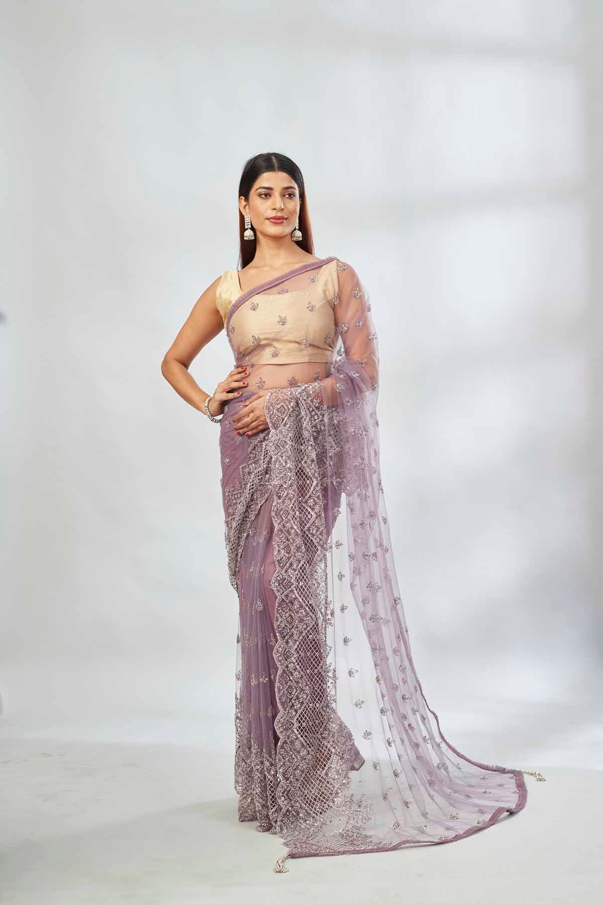 Buy mauve embroidered net designer sari online in USA. Look your best on festive occasions in latest designer saris, pure silk saris, Kanjivaram silk sarees, handwoven saris, tussar silk sarees, linen sarees,  embroidered sarees from Pure Elegance Indian clothing store in USA.-full view