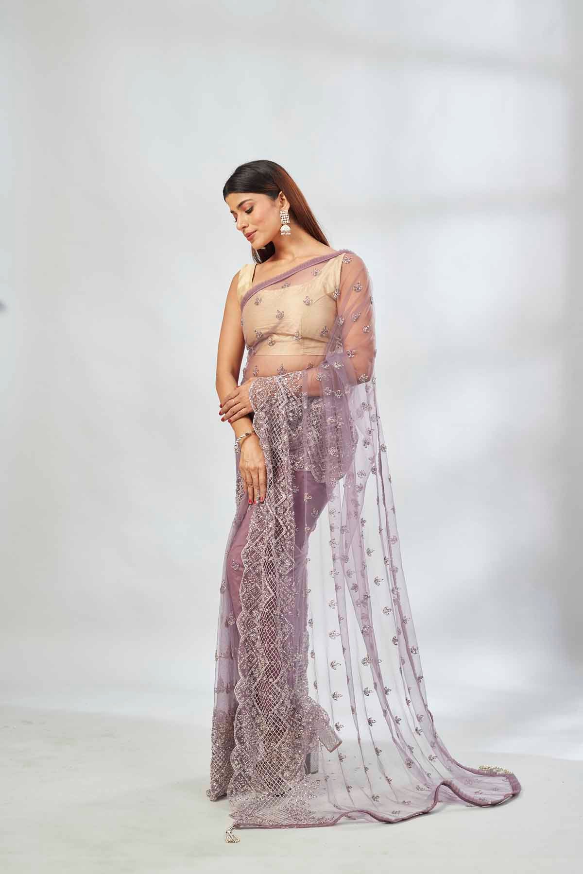 Buy mauve embroidered net designer sari online in USA. Look your best on festive occasions in latest designer saris, pure silk saris, Kanjivaram silk sarees, handwoven saris, tussar silk sarees, linen sarees,  embroidered sarees from Pure Elegance Indian clothing store in USA.-front