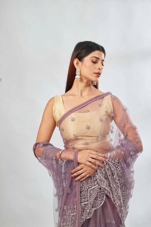 Buy mauve embroidered net designer sari online in USA. Look your best on festive occasions in latest designer saris, pure silk saris, Kanjivaram silk sarees, handwoven saris, tussar silk sarees, linen sarees,  embroidered sarees from Pure Elegance Indian clothing store in USA.-closeup