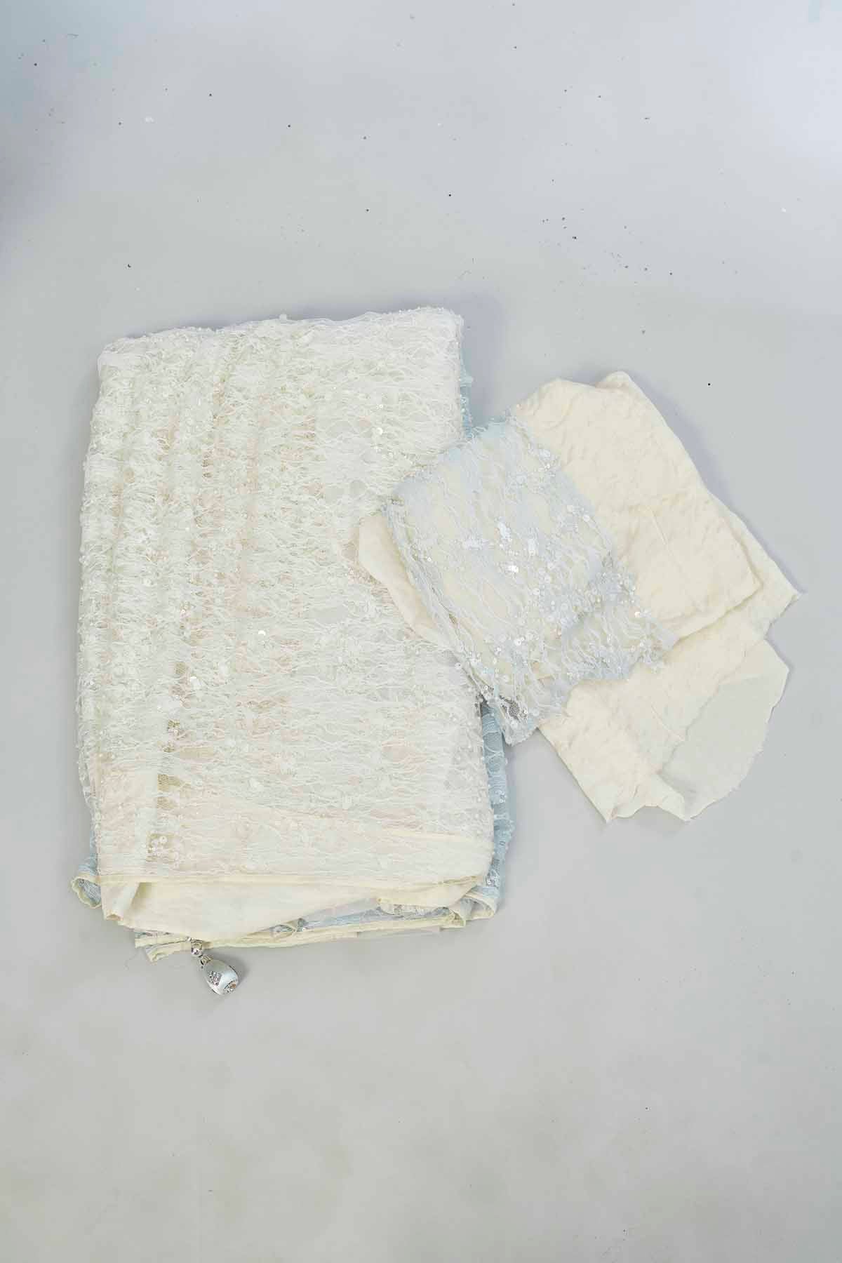 Buy powder blue and cream embroidered net designer sari online in USA. Look your best on festive occasions in latest designer saris, pure silk saris, Kanjivaram silk sarees, handwoven saris, tussar silk sarees, linen sarees,  embroidered sarees from Pure Elegance Indian clothing store in USA.-blouse
