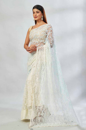 Buy powder blue and cream embroidered net designer sari online in USA. Look your best on festive occasions in latest designer saris, pure silk saris, Kanjivaram silk sarees, handwoven saris, tussar silk sarees, linen sarees,  embroidered sarees from Pure Elegance Indian clothing store in USA.-pallu