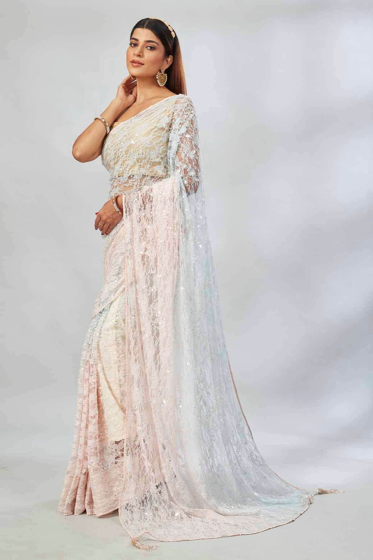 Buy cream and powder blue embroidered designer net sari online in USA. Look your best on festive occasions in latest designer saris, pure silk saris, Kanjivaram silk sarees, handwoven saris, tussar silk sarees, linen sarees,  embroidered sarees from Pure Elegance Indian clothing store in USA.-pallu
