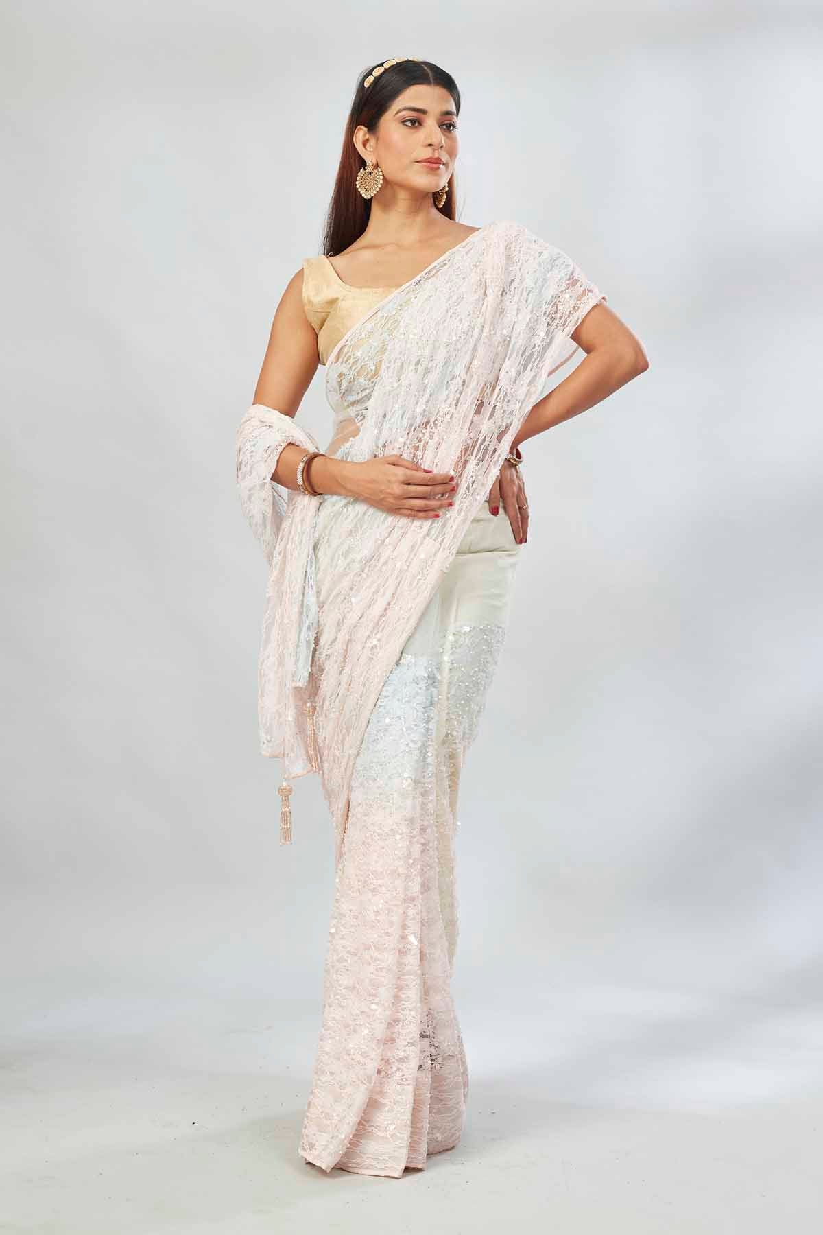Buy cream and powder blue embroidered designer net sari online in USA. Look your best on festive occasions in latest designer saris, pure silk saris, Kanjivaram silk sarees, handwoven saris, tussar silk sarees, linen sarees,  embroidered sarees from Pure Elegance Indian clothing store in USA.-full view