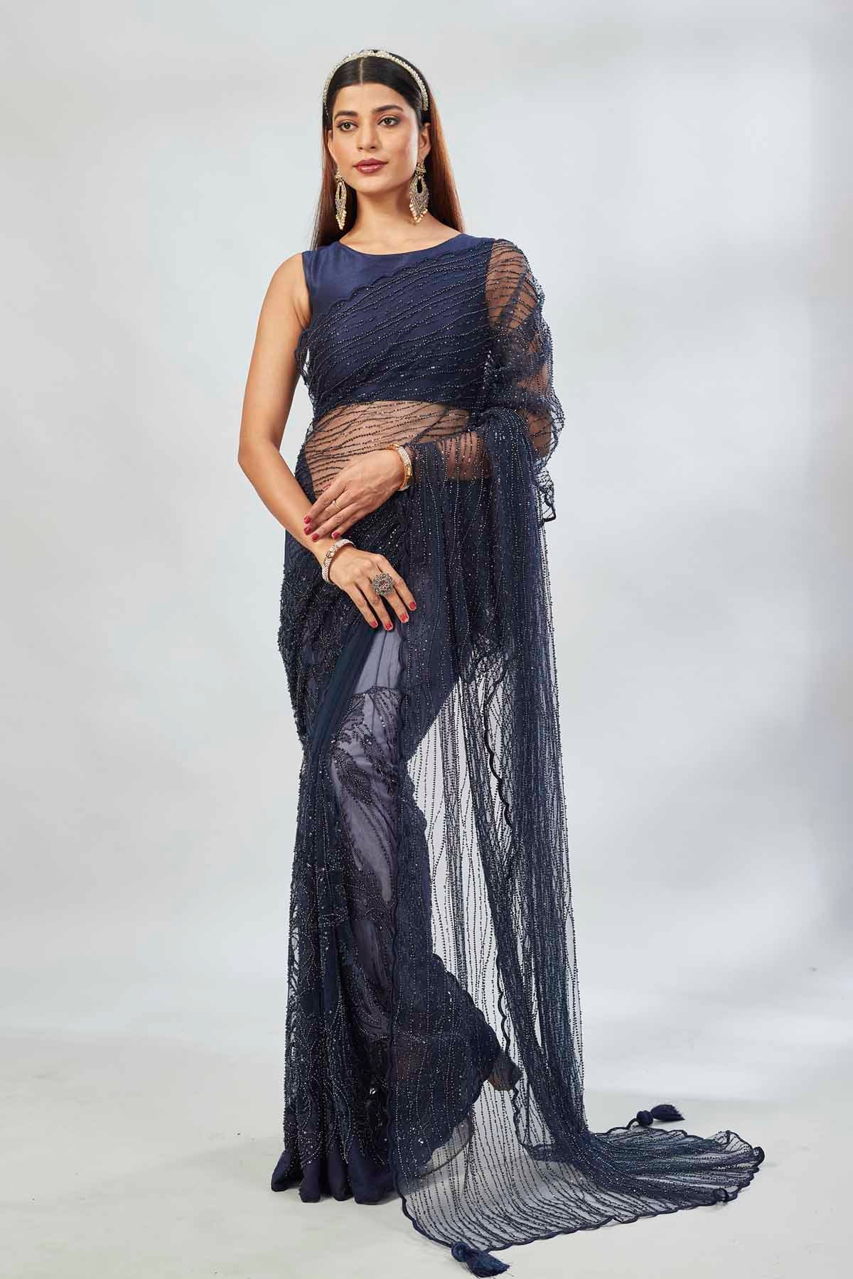Buy stunning navy designer net sari online in USA with overall embroidery. Look your best on festive occasions in latest designer saris, pure silk saris, Kanjivaram silk sarees, handwoven saris, tussar silk sarees, linen sarees,  embroidered sarees from Pure Elegance Indian clothing store in USA.-full view