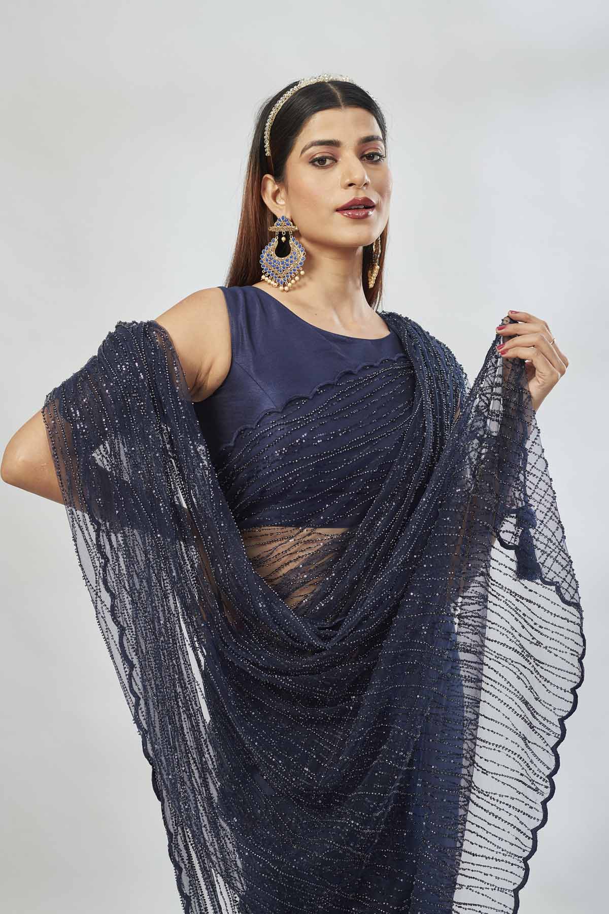 Buy stunning navy designer net sari online in USA with overall embroidery. Look your best on festive occasions in latest designer saris, pure silk saris, Kanjivaram silk sarees, handwoven saris, tussar silk sarees, linen sarees,  embroidered sarees from Pure Elegance Indian clothing store in USA.-closeup