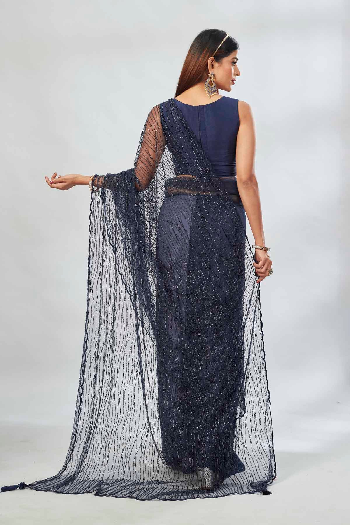 Buy stunning navy designer net sari online in USA with overall embroidery. Look your best on festive occasions in latest designer saris, pure silk saris, Kanjivaram silk sarees, handwoven saris, tussar silk sarees, linen sarees,  embroidered sarees from Pure Elegance Indian clothing store in USA.-back