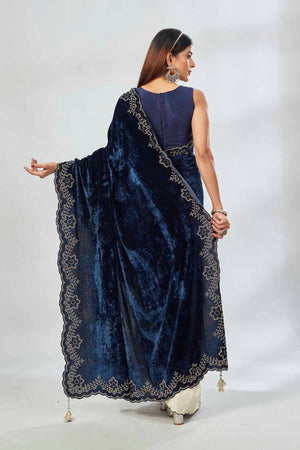 Buy cream and navy blue stone work velvet sari online in USA. Look your best on festive occasions in latest designer saris, pure silk saris, Kanjivaram silk sarees, handwoven saris, tussar silk sarees, linen sarees,  embroidered sarees from Pure Elegance Indian clothing store in USA.-back