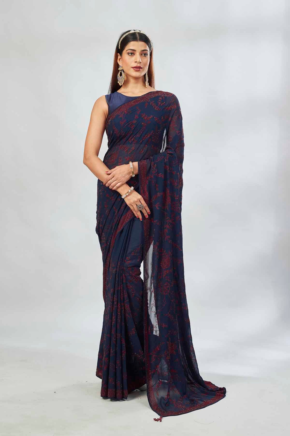 Shop navy blue embroidered georgette sari online in USA. Look your best on festive occasions in latest designer saris, pure silk saris, Kanjivaram silk sarees, handwoven saris, silk sarees, linen sarees,  embroidered sarees from Pure Elegance Indian clothing store in USA.-full view