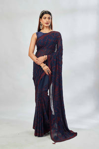Shop navy blue embroidered georgette sari online in USA. Look your best on festive occasions in latest designer saris, pure silk saris, Kanjivaram silk sarees, handwoven saris, silk sarees, linen sarees,  embroidered sarees from Pure Elegance Indian clothing store in USA.-full view