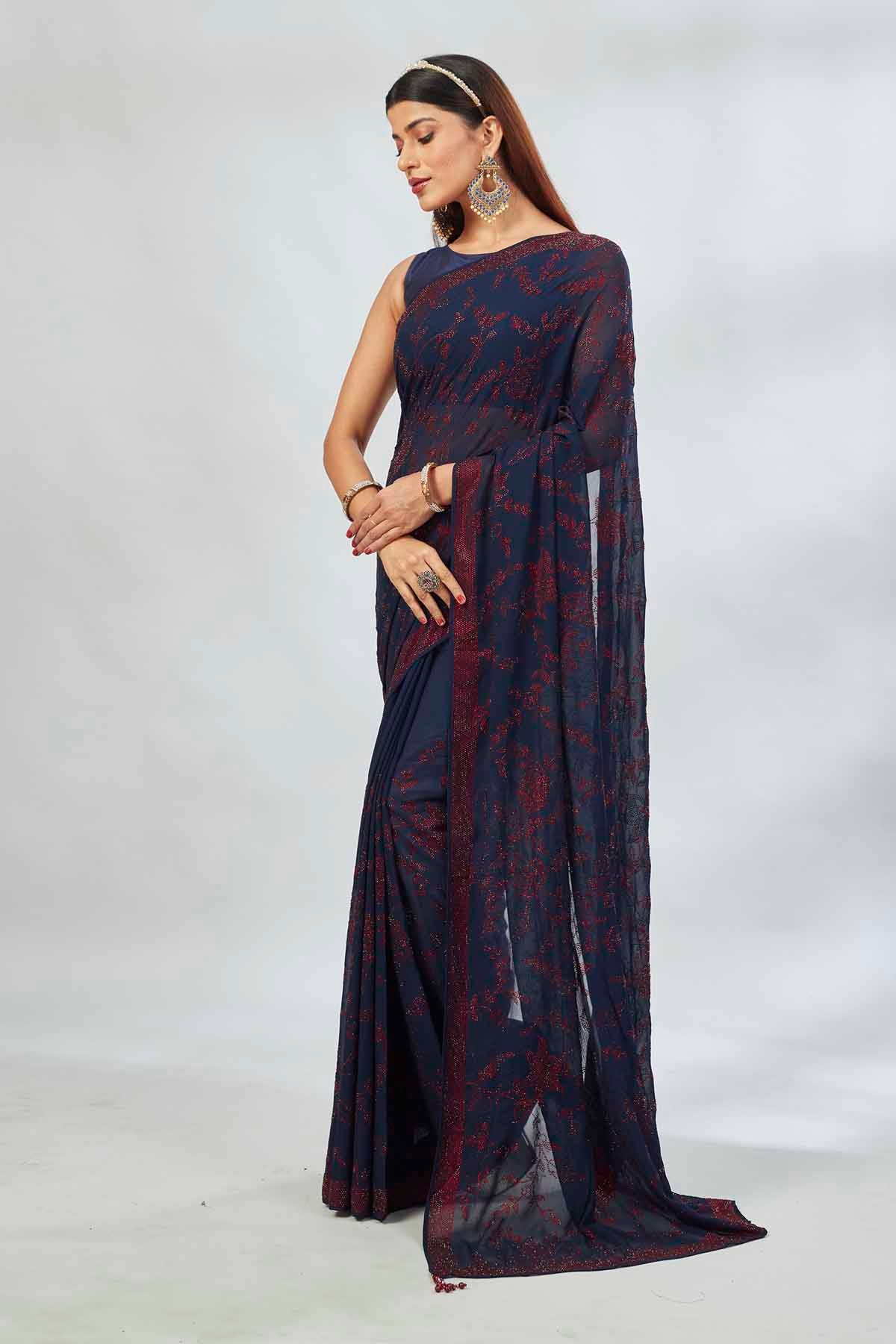 Shop navy blue embroidered georgette sari online in USA. Look your best on festive occasions in latest designer saris, pure silk saris, Kanjivaram silk sarees, handwoven saris, silk sarees, linen sarees,  embroidered sarees from Pure Elegance Indian clothing store in USA.-pallu
