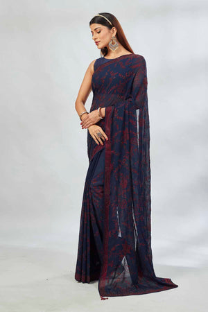 Shop navy blue embroidered georgette sari online in USA. Look your best on festive occasions in latest designer saris, pure silk saris, Kanjivaram silk sarees, handwoven saris, silk sarees, linen sarees,  embroidered sarees from Pure Elegance Indian clothing store in USA.-pallu