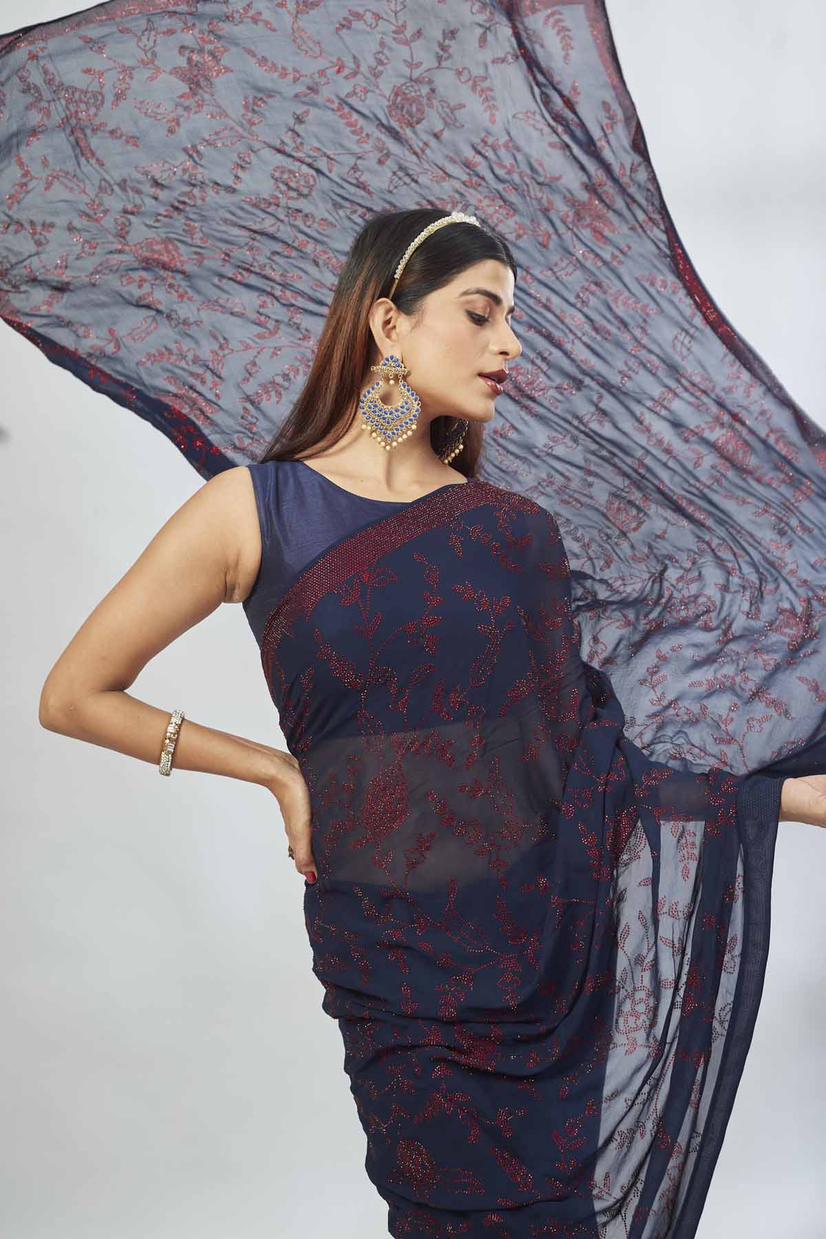 Shop navy blue embroidered georgette sari online in USA. Look your best on festive occasions in latest designer saris, pure silk saris, Kanjivaram silk sarees, handwoven saris, silk sarees, linen sarees,  embroidered sarees from Pure Elegance Indian clothing store in USA.-closeup