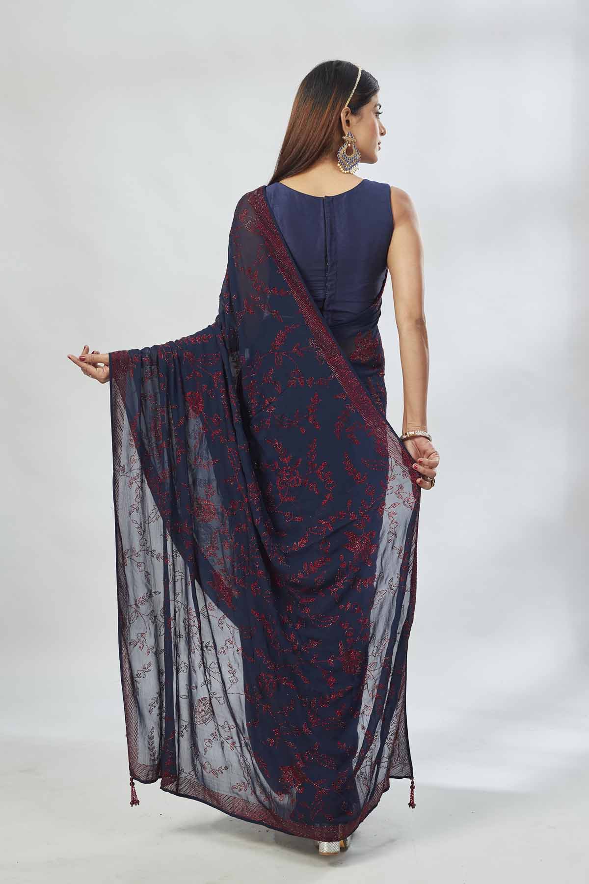 Shop navy blue embroidered georgette sari online in USA. Look your best on festive occasions in latest designer saris, pure silk saris, Kanjivaram silk sarees, handwoven saris, silk sarees, linen sarees,  embroidered sarees from Pure Elegance Indian clothing store in USA.- back
