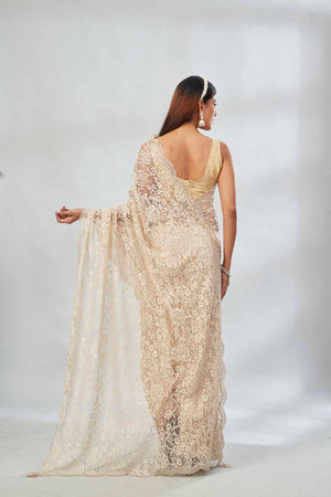 Buy cream embroidered designer lace sari online in USA. Look your best on festive occasions in latest designer saris, pure silk saris, Kanjivaram silk sarees, handwoven saris, tussar silk sarees, linen sarees,  embroidered sarees from Pure Elegance Indian clothing store in USA.-back