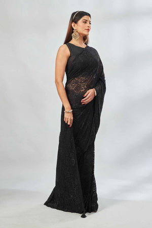 Shop black embroidered lace saree online in USA. Look your best on festive occasions in latest designer saris, pure silk saris, Kanjivaram silk sarees, handwoven saris, tussar silk sarees, linen sarees,  embroidered sarees from Pure Elegance Indian clothing store in USA.-side