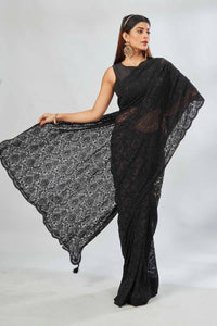Shop black embroidered lace saree online in USA. Look your best on festive occasions in latest designer saris, pure silk saris, Kanjivaram silk sarees, handwoven saris, tussar silk sarees, linen sarees,  embroidered sarees from Pure Elegance Indian clothing store in USA.-full view