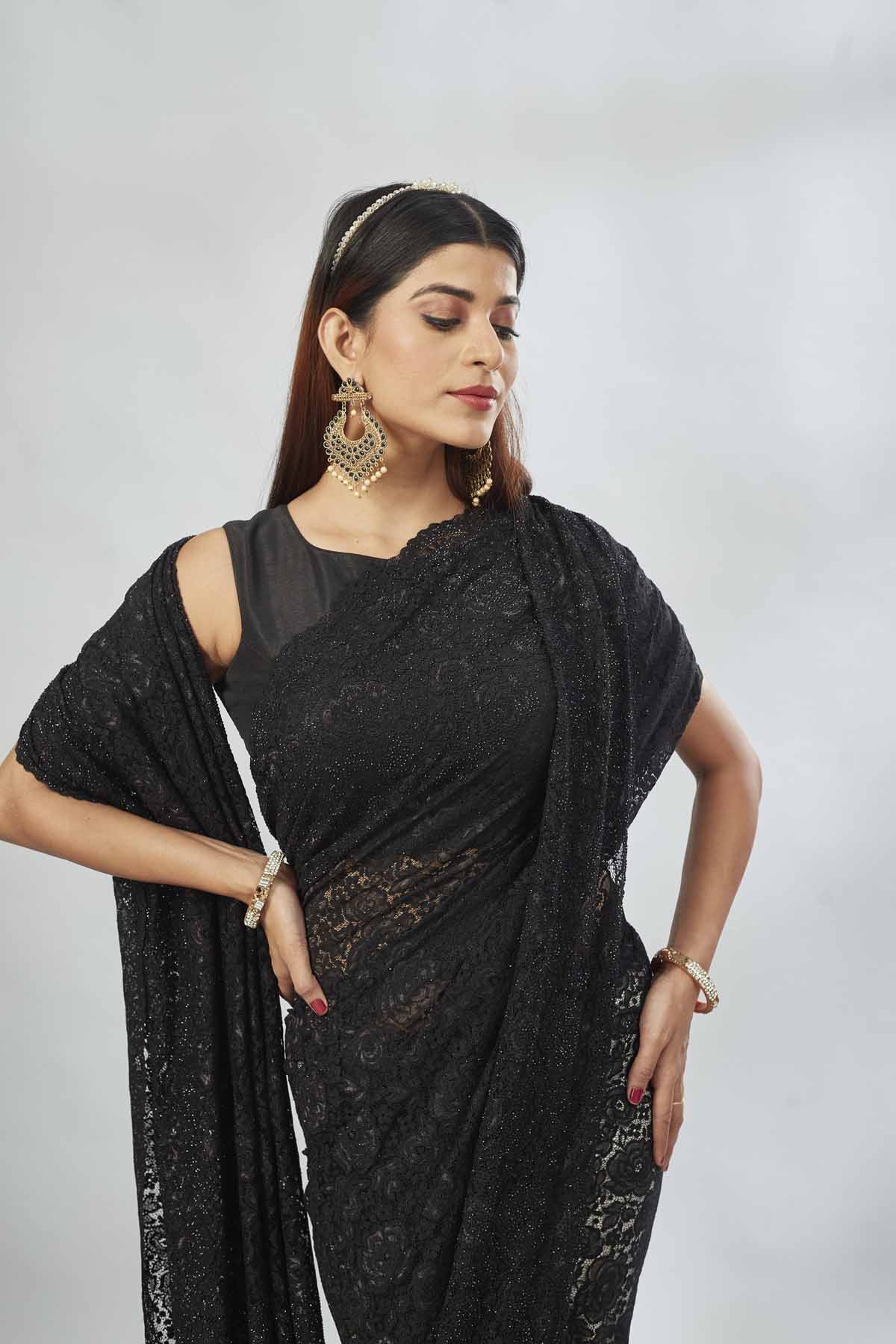 Shop black embroidered lace saree online in USA. Look your best on festive occasions in latest designer saris, pure silk saris, Kanjivaram silk sarees, handwoven saris, tussar silk sarees, linen sarees,  embroidered sarees from Pure Elegance Indian clothing store in USA.-closeup