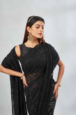 Shop black embroidered lace saree online in USA. Look your best on festive occasions in latest designer saris, pure silk saris, Kanjivaram silk sarees, handwoven saris, tussar silk sarees, linen sarees,  embroidered sarees from Pure Elegance Indian clothing store in USA.-closeup