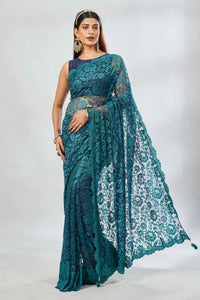 Shop stunning teal embroidered lace saree online in USA. Look your best on festive occasions in latest designer saris, pure silk saris, Kanjivaram silk sarees, handwoven saris, tussar silk sarees, linen sarees,  embroidered sarees from Pure Elegance Indian clothing store in USA.-full view
