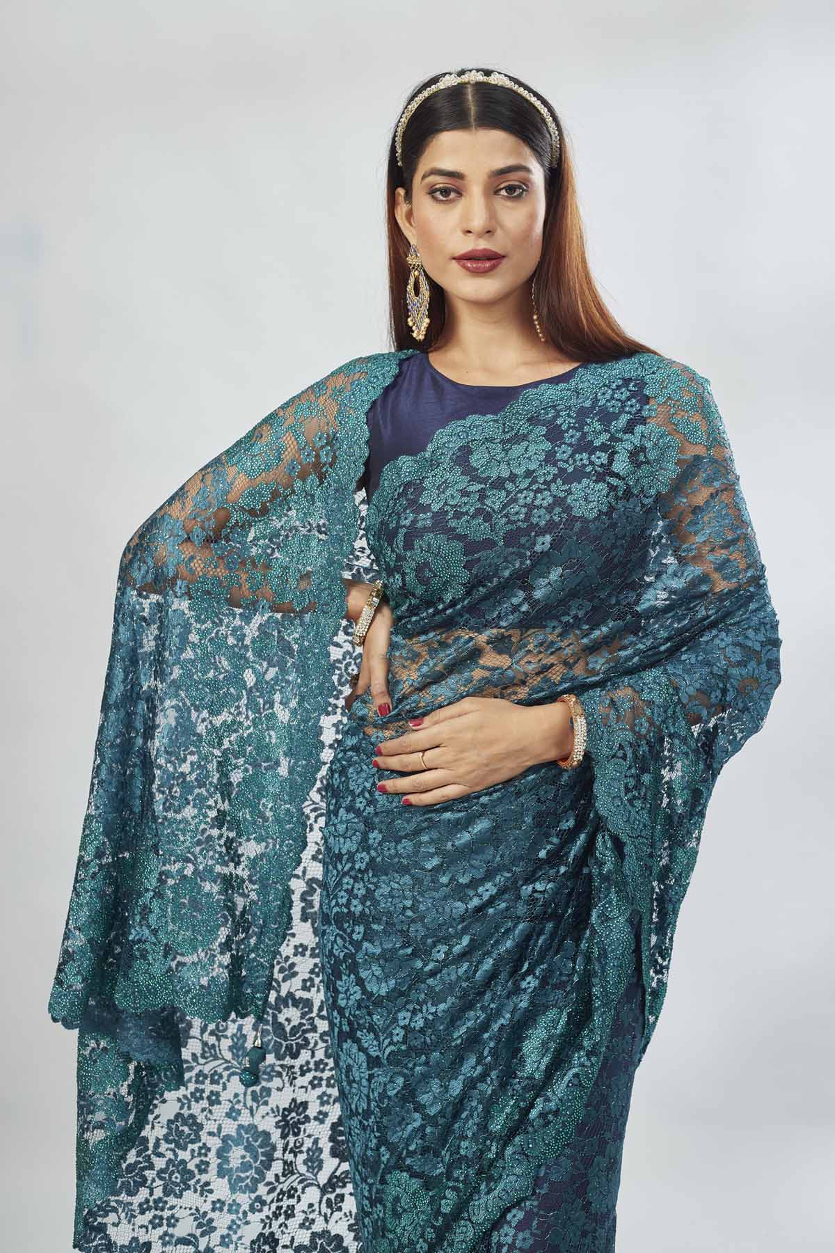 Shop stunning teal embroidered lace saree online in USA. Look your best on festive occasions in latest designer saris, pure silk saris, Kanjivaram silk sarees, handwoven saris, tussar silk sarees, linen sarees,  embroidered sarees from Pure Elegance Indian clothing store in USA.-closeup