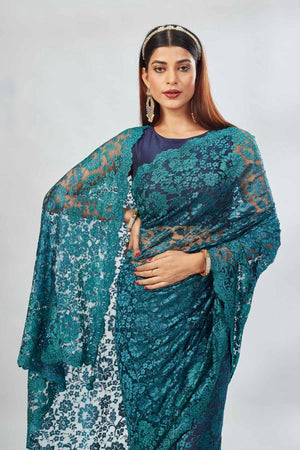 Shop stunning teal embroidered lace saree online in USA. Look your best on festive occasions in latest designer saris, pure silk saris, Kanjivaram silk sarees, handwoven saris, tussar silk sarees, linen sarees,  embroidered sarees from Pure Elegance Indian clothing store in USA.-closeup