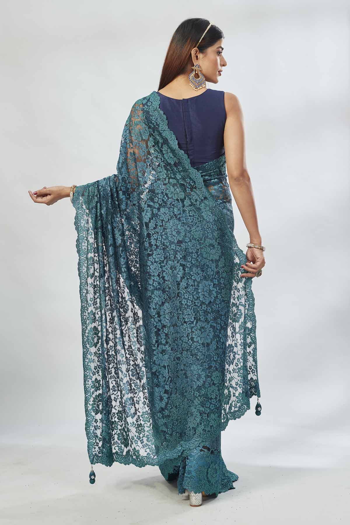 Shop stunning teal embroidered lace saree online in USA. Look your best on festive occasions in latest designer saris, pure silk saris, Kanjivaram silk sarees, handwoven saris, tussar silk sarees, linen sarees,  embroidered sarees from Pure Elegance Indian clothing store in USA.-back