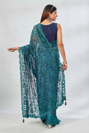 Shop stunning teal embroidered lace saree online in USA. Look your best on festive occasions in latest designer saris, pure silk saris, Kanjivaram silk sarees, handwoven saris, tussar silk sarees, linen sarees,  embroidered sarees from Pure Elegance Indian clothing store in USA.-back