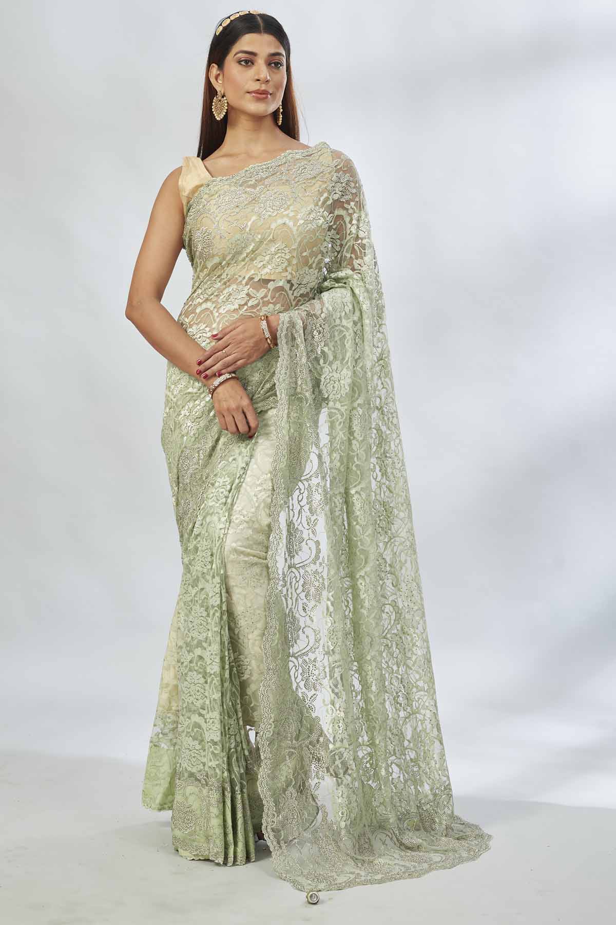 Buy elegant pastel  green embroidered lace saree online in USA. Look your best on festive occasions in latest designer saris, pure silk saris, Kanjivaram silk sarees, handwoven saris, tussar silk sarees, linen sarees,  embroidered sarees from Pure Elegance Indian clothing store in USA.-full view