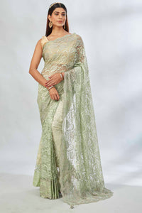Buy elegant pastel  green embroidered lace saree online in USA. Look your best on festive occasions in latest designer saris, pure silk saris, Kanjivaram silk sarees, handwoven saris, tussar silk sarees, linen sarees,  embroidered sarees from Pure Elegance Indian clothing store in USA.-full view