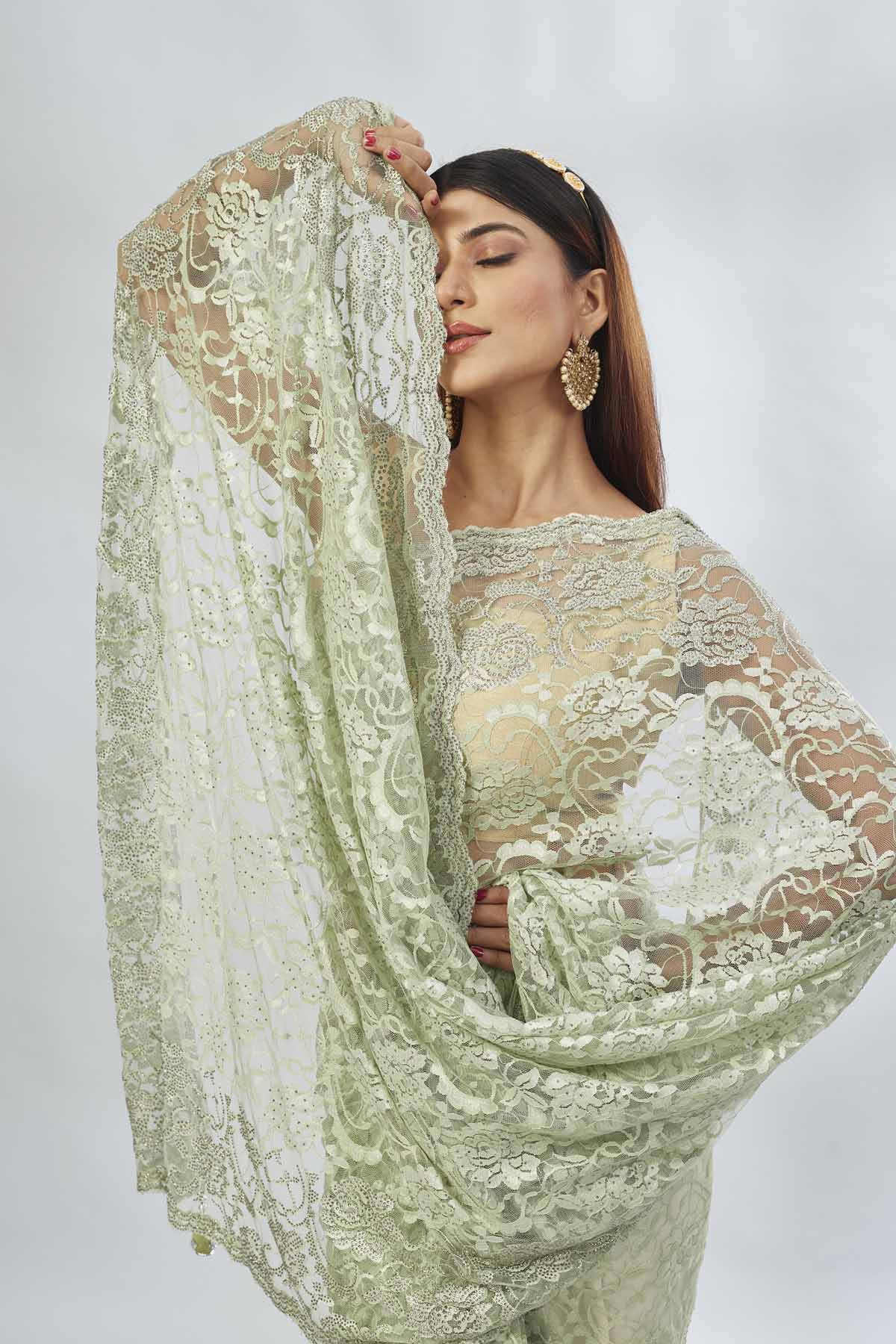 Buy elegant pastel  green embroidered lace saree online in USA. Look your best on festive occasions in latest designer saris, pure silk saris, Kanjivaram silk sarees, handwoven saris, tussar silk sarees, linen sarees,  embroidered sarees from Pure Elegance Indian clothing store in USA.-closeup