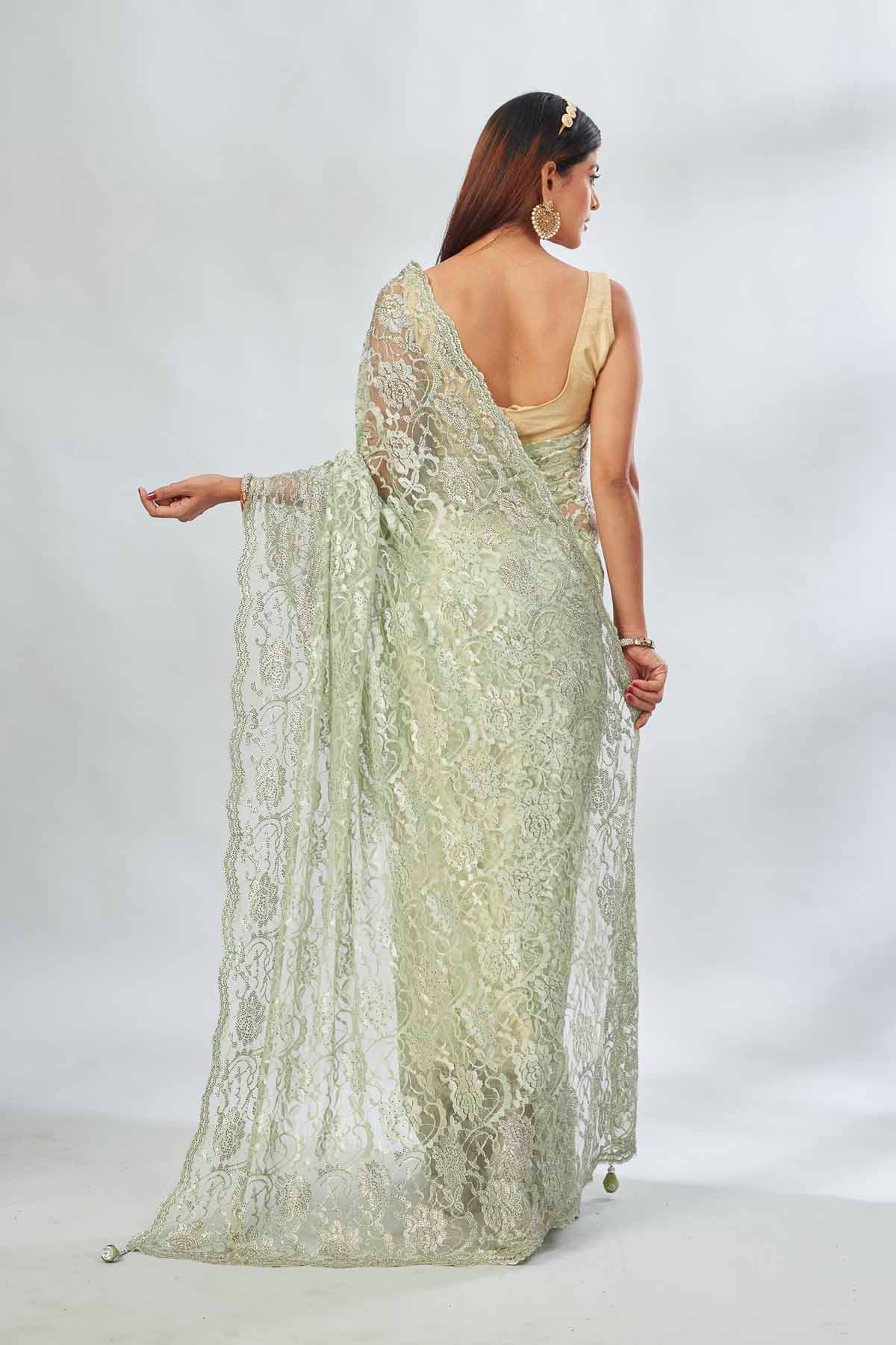 Buy elegant pastel  green embroidered lace saree online in USA. Look your best on festive occasions in latest designer saris, pure silk saris, Kanjivaram silk sarees, handwoven saris, tussar silk sarees, linen sarees,  embroidered sarees from Pure Elegance Indian clothing store in USA.-back