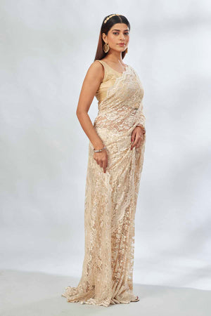 Shop elegant cream embroidered lace saree online in USA. Look your best on festive occasions in latest designer saris, pure silk saris, Kanjivaram silk sarees, handwoven saris, tussar silk sarees, linen sarees,  embroidered sarees from Pure Elegance Indian clothing store in USA.-side