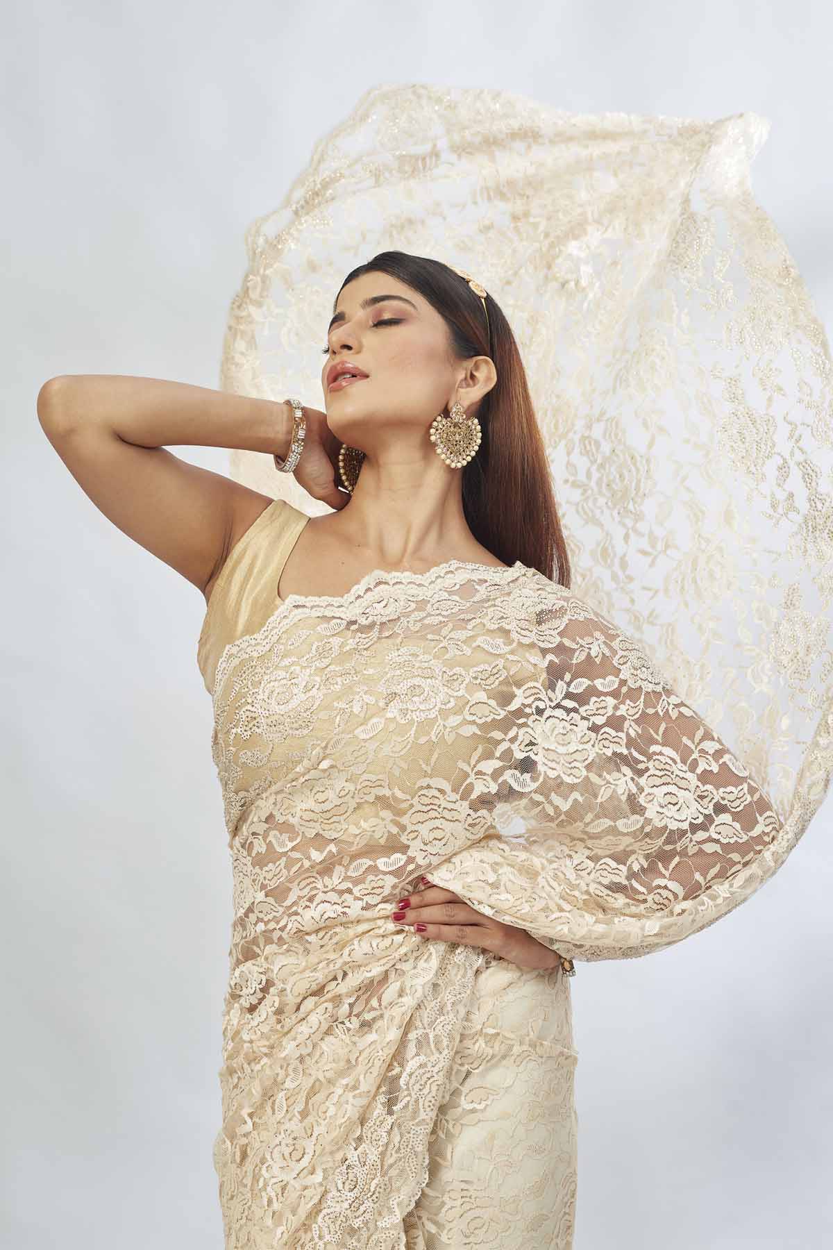 Shop elegant cream embroidered lace saree online in USA. Look your best on festive occasions in latest designer saris, pure silk saris, Kanjivaram silk sarees, handwoven saris, tussar silk sarees, linen sarees,  embroidered sarees from Pure Elegance Indian clothing store in USA.-closeup