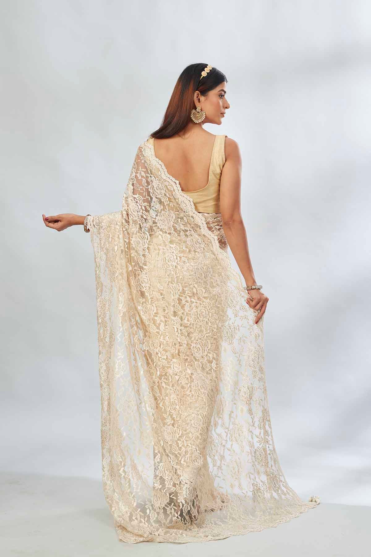 Shop elegant cream embroidered lace saree online in USA. Look your best on festive occasions in latest designer saris, pure silk saris, Kanjivaram silk sarees, handwoven saris, tussar silk sarees, linen sarees,  embroidered sarees from Pure Elegance Indian clothing store in USA.-back