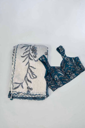 Shop green and cream sequin embroidered saree online in USA with blouse. Look your best on festive occasions in latest designer saris, pure silk saris, Kanjivaram silk sarees, handwoven saris, tussar silk sarees, linen sarees,  embroidered sarees from Pure Elegance Indian clothing store in USA.-blouse