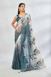 Shop green and cream sequin embroidered saree online in USA with blouse. Look your best on festive occasions in latest designer saris, pure silk saris, Kanjivaram silk sarees, handwoven saris, tussar silk sarees, linen sarees,  embroidered sarees from Pure Elegance Indian clothing store in USA.-full view