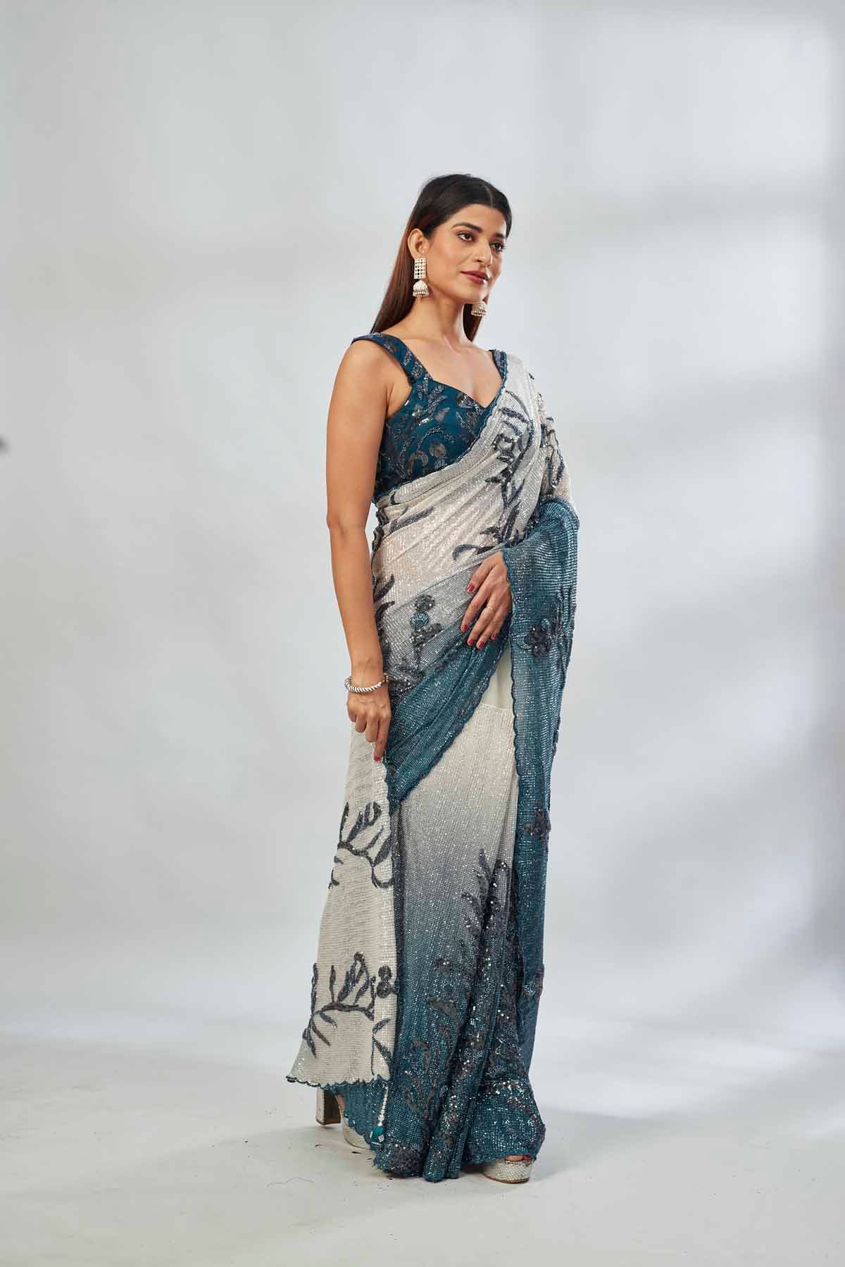 Shop green and cream sequin embroidered saree online in USA with blouse. Look your best on festive occasions in latest designer saris, pure silk saris, Kanjivaram silk sarees, handwoven saris, tussar silk sarees, linen sarees,  embroidered sarees from Pure Elegance Indian clothing store in USA.-saree