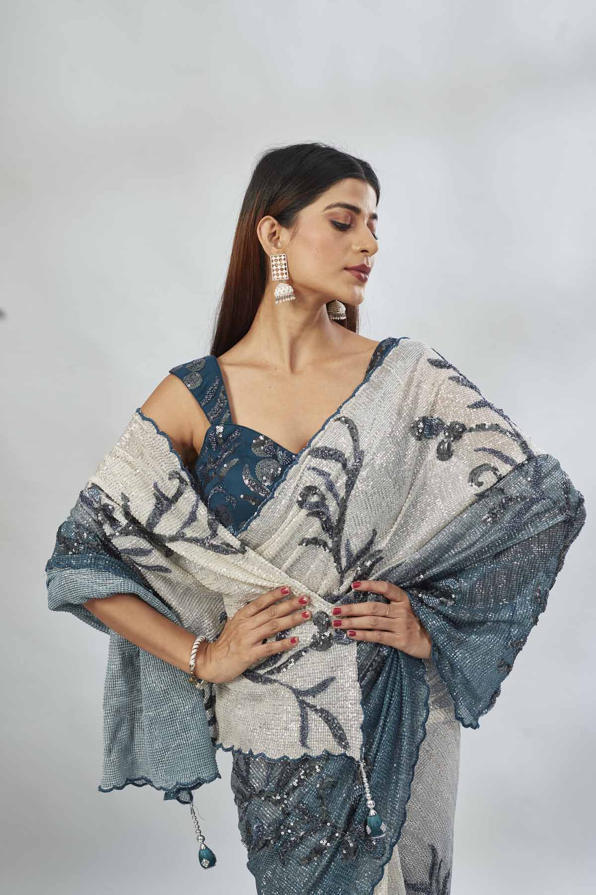 Shop green and cream sequin embroidered saree online in USA with blouse. Look your best on festive occasions in latest designer saris, pure silk saris, Kanjivaram silk sarees, handwoven saris, tussar silk sarees, linen sarees,  embroidered sarees from Pure Elegance Indian clothing store in USA.-closeup