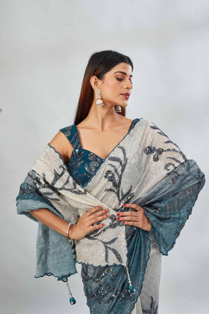 Shop green and cream sequin embroidered saree online in USA with blouse. Look your best on festive occasions in latest designer saris, pure silk saris, Kanjivaram silk sarees, handwoven saris, tussar silk sarees, linen sarees,  embroidered sarees from Pure Elegance Indian clothing store in USA.-closeup