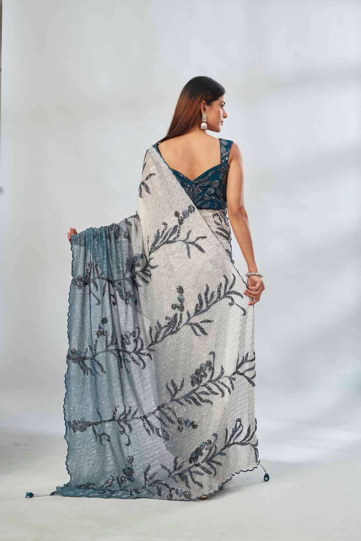 Shop green and cream sequin embroidered saree online in USA with blouse. Look your best on festive occasions in latest designer saris, pure silk saris, Kanjivaram silk sarees, handwoven saris, tussar silk sarees, linen sarees,  embroidered sarees from Pure Elegance Indian clothing store in USA.-back