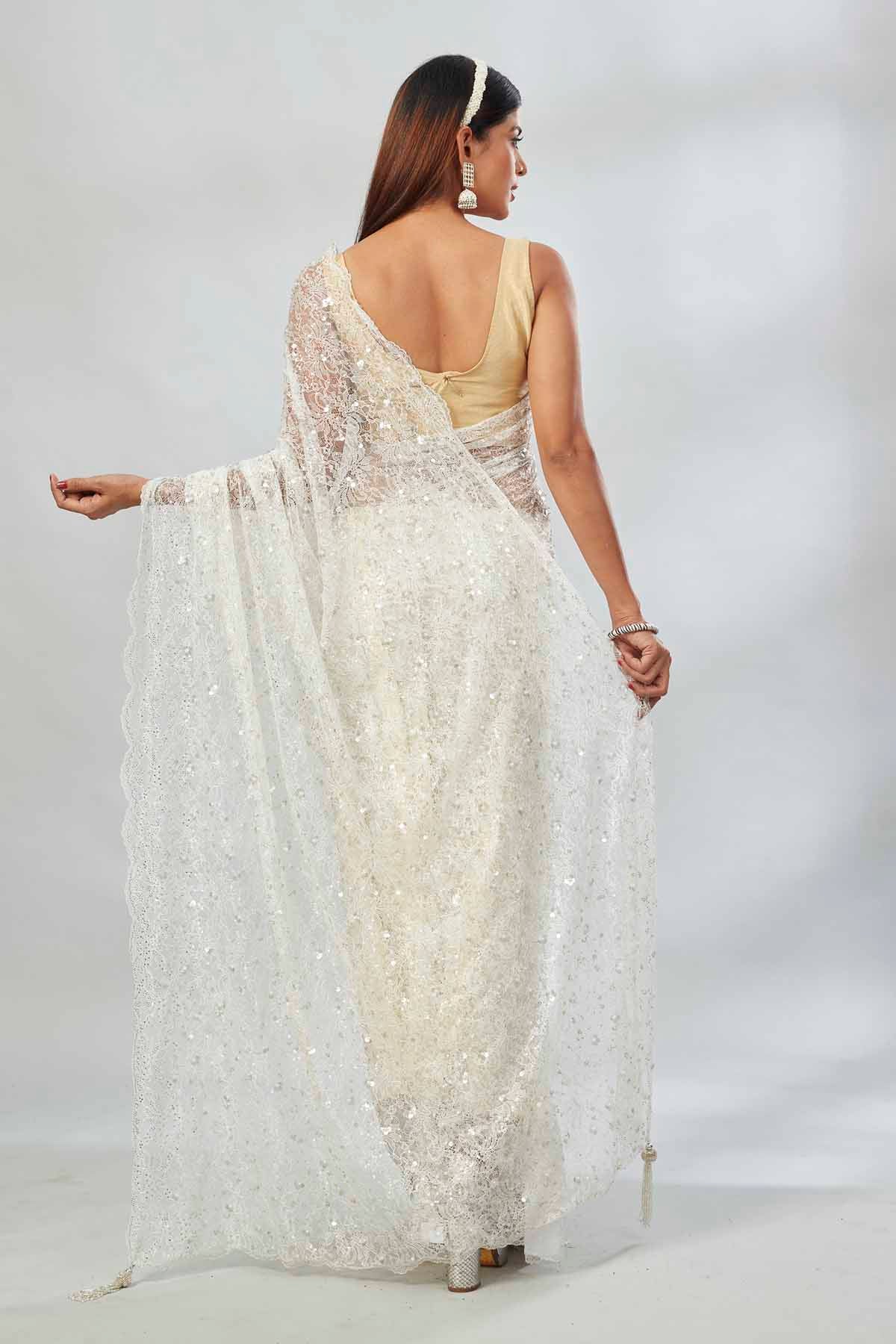 Buy white embroidered lace net designer saree online in USA with blouse. Look your best on festive occasions in latest designer saris, pure silk saris, Kanjivaram silk sarees, handwoven saris, tussar silk sarees, linen sarees,  embroidered sarees from Pure Elegance Indian clothing store in USA.-back