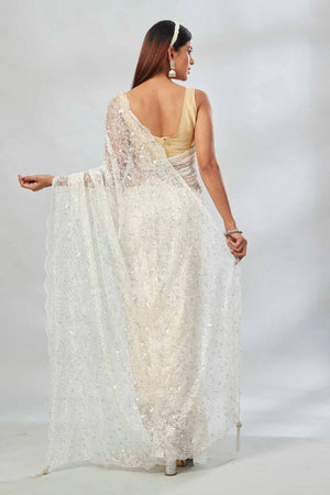 Buy white embroidered lace net designer saree online in USA with blouse. Look your best on festive occasions in latest designer saris, pure silk saris, Kanjivaram silk sarees, handwoven saris, tussar silk sarees, linen sarees,  embroidered sarees from Pure Elegance Indian clothing store in USA.-back