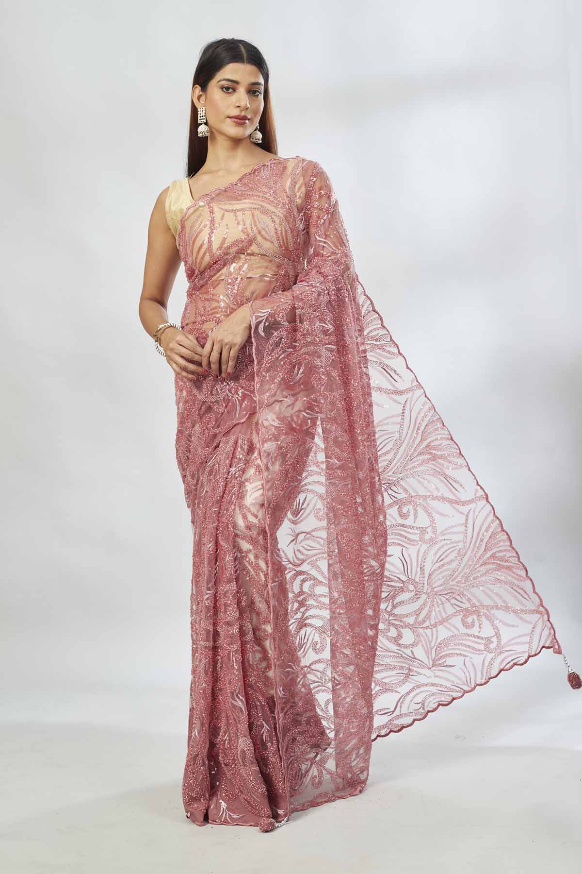 Shop dusty pink embroidered lace net saree online in USA with blouse. Look your best on festive occasions in latest designer saris, pure silk saris, Kanjivaram silk sarees, handwoven saris, tussar silk sarees, linen sarees,  embroidered sarees from Pure Elegance Indian clothing store in USA.-full view