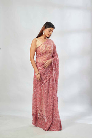 Shop dusty pink embroidered lace net saree online in USA with blouse. Look your best on festive occasions in latest designer saris, pure silk saris, Kanjivaram silk sarees, handwoven saris, tussar silk sarees, linen sarees,  embroidered sarees from Pure Elegance Indian clothing store in USA.-saree