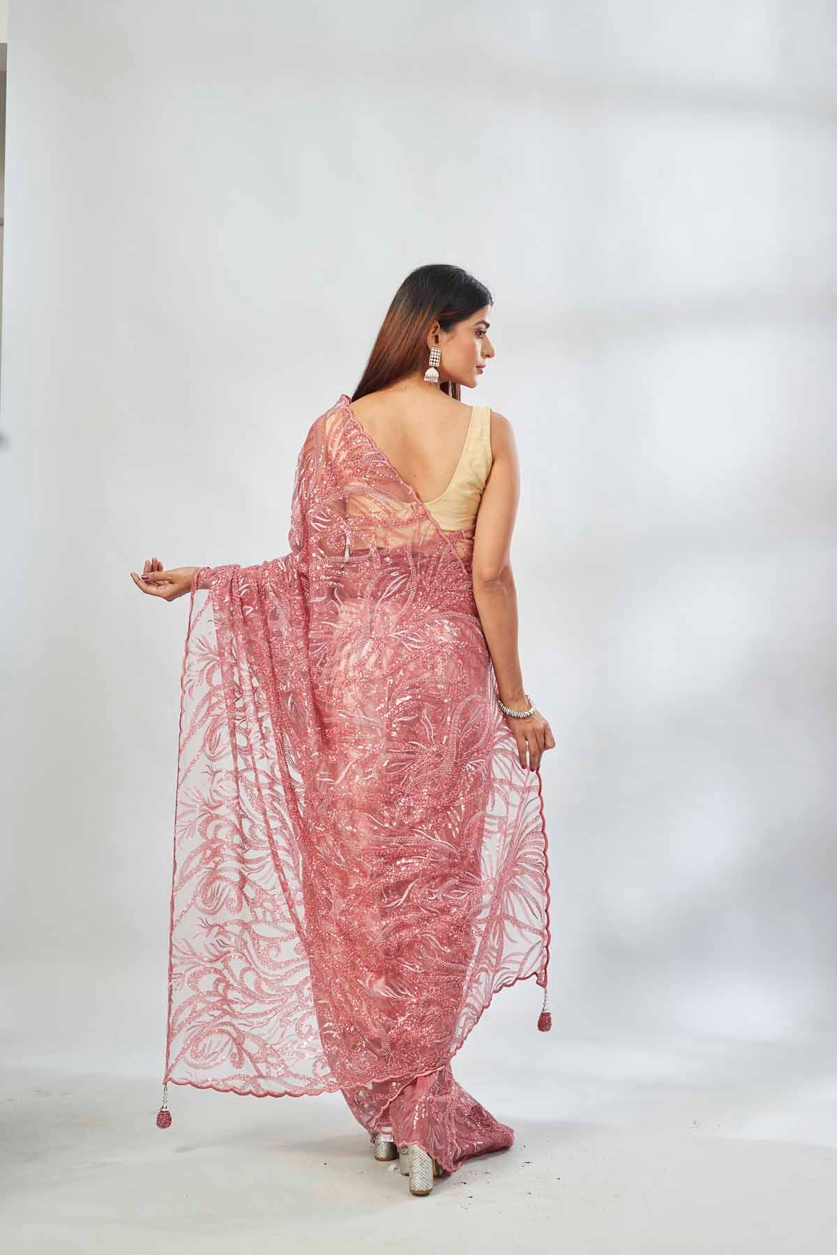 Shop dusty pink embroidered lace net saree online in USA with blouse. Look your best on festive occasions in latest designer saris, pure silk saris, Kanjivaram silk sarees, handwoven saris, tussar silk sarees, linen sarees,  embroidered sarees from Pure Elegance Indian clothing store in USA.-back