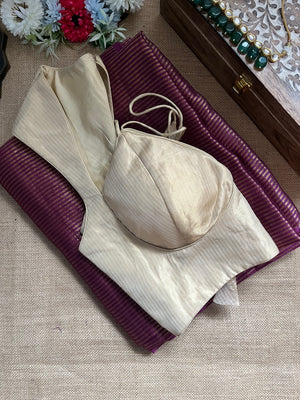 Shop purple tissue zari saree online in USA with cream designer blouse. Look your best on festive occasions in latest designer saris, pure silk saris, Kanjivaram silk sarees, handwoven saris, tussar silk sarees, linen sarees,  summer sarees from Pure Elegance Indian clothing store in USA.-side